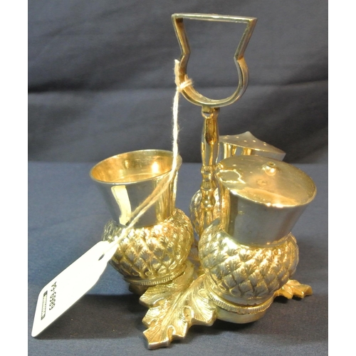 26 - Scottish silver plated condiment set of triple thistle form, shaped handle and cast leaf base