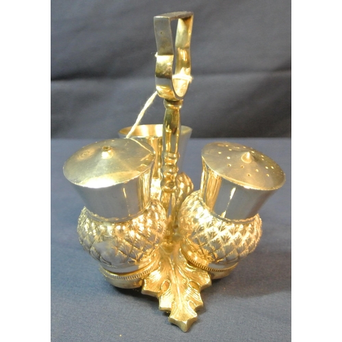 26 - Scottish silver plated condiment set of triple thistle form, shaped handle and cast leaf base