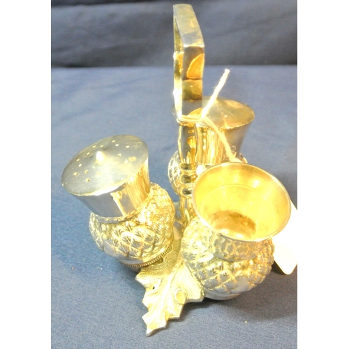 26 - Scottish silver plated condiment set of triple thistle form, shaped handle and cast leaf base