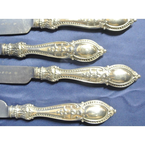 7 - Set of 12 silverplated knives and forks with foliate decorated handles