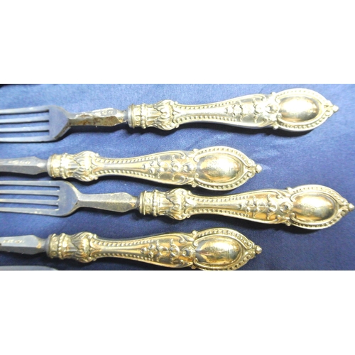 7 - Set of 12 silverplated knives and forks with foliate decorated handles