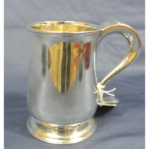 138 - George III Newcastle silver tankard of baluster form with wire rim, scroll handle and round stepped ... 