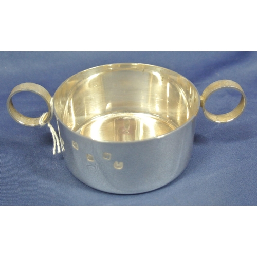 212 - Irish silver round porringer with round handles, makers mark 'DMH' bearing Gleninsheen Collar commem... 