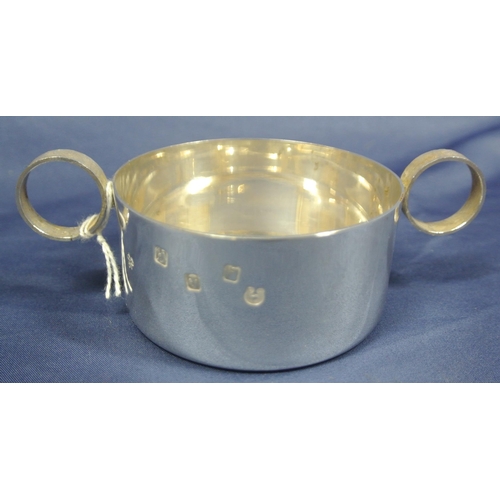 212 - Irish silver round porringer with round handles, makers mark 'DMH' bearing Gleninsheen Collar commem... 