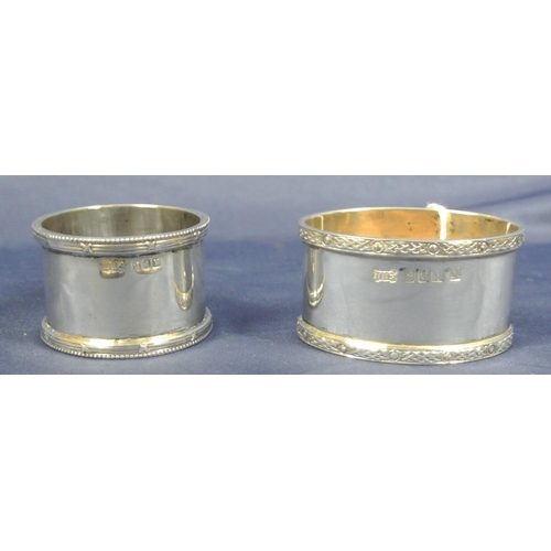 242 - 2 Irish silver napkin rings with decorated rims, by William Egan & Sons, Cork, 1963, & 1966 with Swo... 