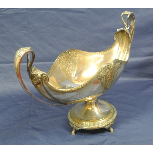 3 - Oval silverplated vase with serpentine rims, scroll and foliate decoration, shaped handles, on 3 cas... 