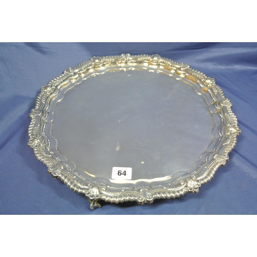 64 - Large Sheffield silver serving tray with raised gadroon and scroll border, on 3 cast claw-on-ball fe... 