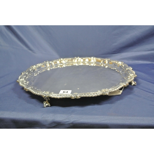 64 - Large Sheffield silver serving tray with raised gadroon and scroll border, on 3 cast claw-on-ball fe... 