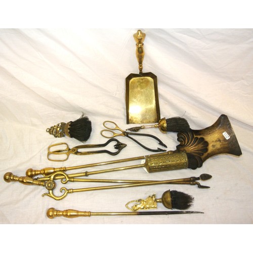 100 - Assorted lot of brass fire implements, rests, shovel, etc
