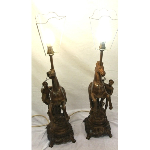 157 - Pair of Victorian style spelter Marley horse & figure decorated electric table lamps with ornate bas... 