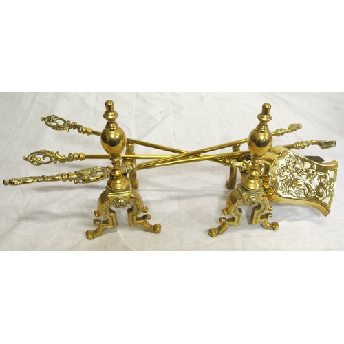 228 - Set of 3 Victorian style brass fire implements with ornate pierced handles and a pair of brass rests