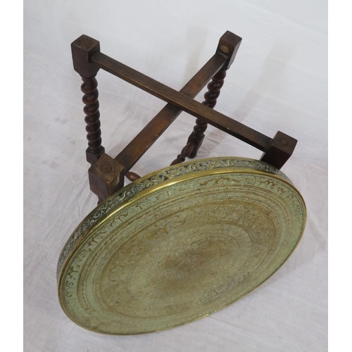 129 - Indian Benares brass occasional table with folding base