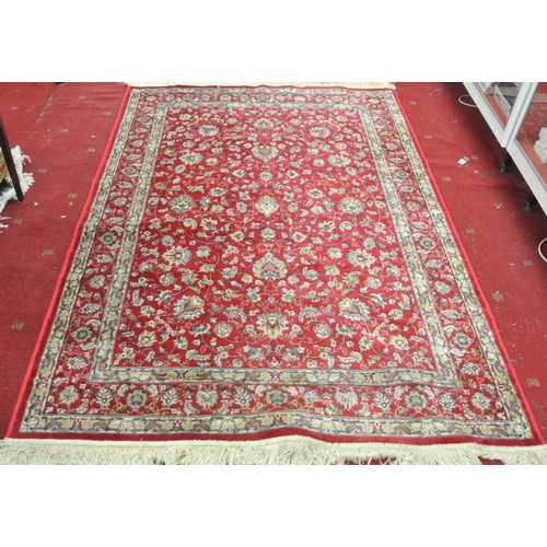 132 - Red ground full pile Kashmir rug with all over floral pattern 220 x130 cm