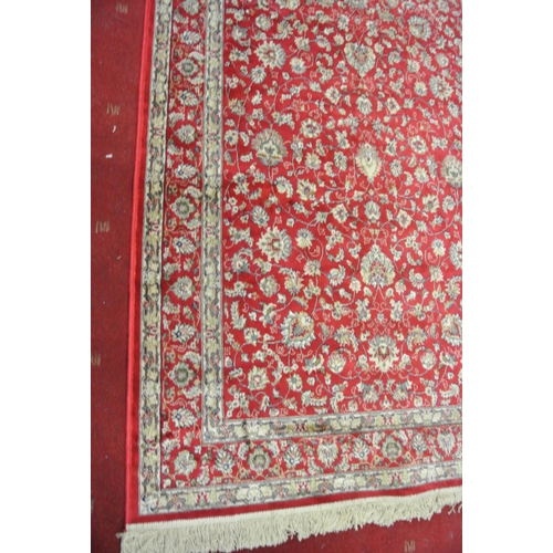 132 - Red ground full pile Kashmir rug with all over floral pattern 220 x130 cm