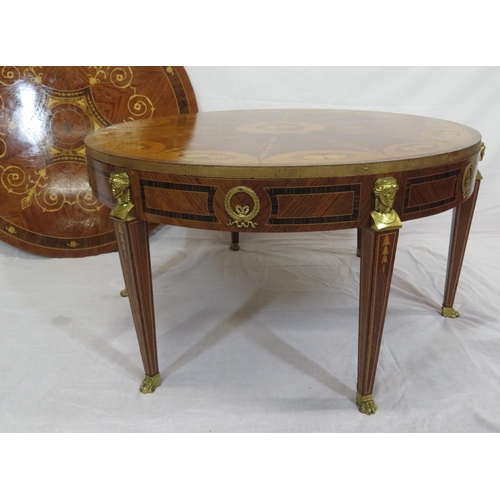 135 - Edwardian style inlaid and crossbanded round occasional or centre table with figured mounts, taperin... 