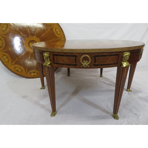 135 - Edwardian style inlaid and crossbanded round occasional or centre table with figured mounts, taperin... 