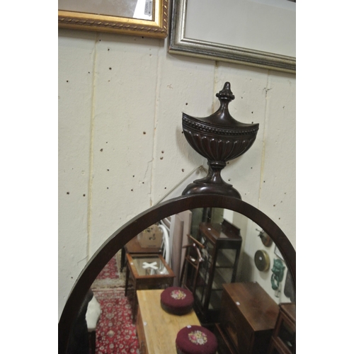 143 - Regency design oval mahogany framed mirror with urn pediment