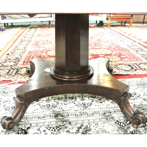 150 - Victorian mahogany dining or library table with tip-up top, hexagonal tapering column with round col... 