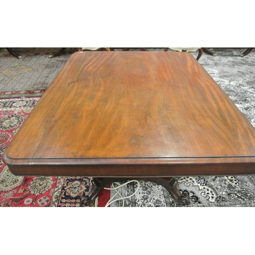 150 - Victorian mahogany dining or library table with tip-up top, hexagonal tapering column with round col... 