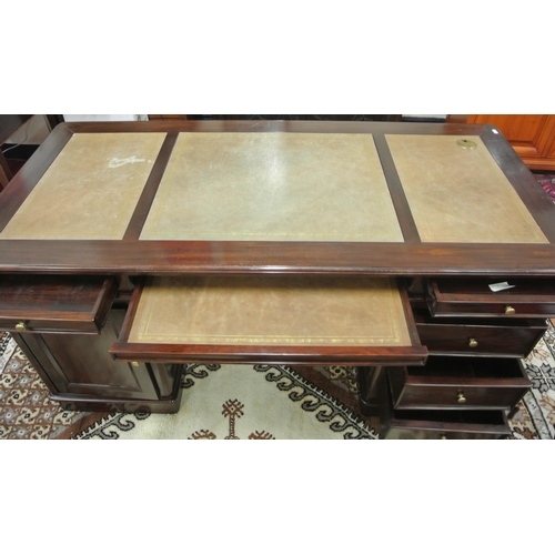 165 - Mahogany pedestal desk with leatherette insets, 2 frieze drawers, shelf, side drawers, on plinths