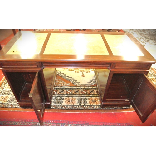 165 - Mahogany pedestal desk with leatherette insets, 2 frieze drawers, shelf, side drawers, on plinths