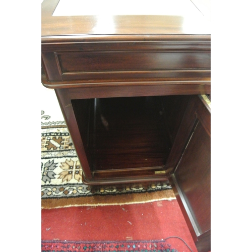 165 - Mahogany pedestal desk with leatherette insets, 2 frieze drawers, shelf, side drawers, on plinths