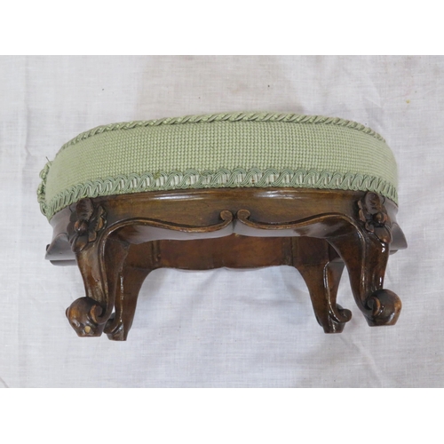 172 - 2 round Georgian style footstools with foliate upholstery and shaped legs