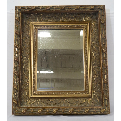 173 - Regency design gilt framed bevelled wall mirror with ornate foliate decoration