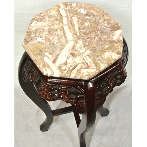 176 - Oriental style bust or plant stand with hexagonal marble top, foliate apron, on sabre legs