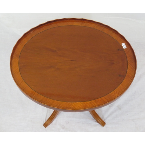 196 - Oval inlaid yew occasional table with wavy rim, turned column, on reeded shaped legs