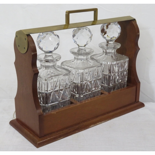 233 - Edwardian brass and mahogany tantalus with 3 decanters, locking drop down front