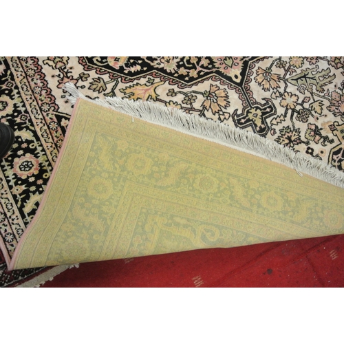 244 - Iranian cream ground rug with traditional floral pattern