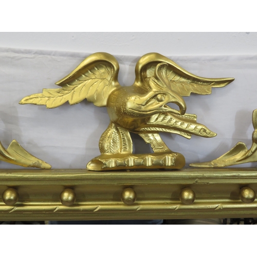 281 - Regency style gilt framed overmantle with eagle pediment and ball decoration