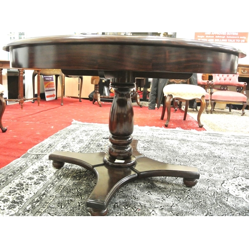 295 - Victorian mahogany round dining or library table raised on baluster turned column, on concave plinth... 