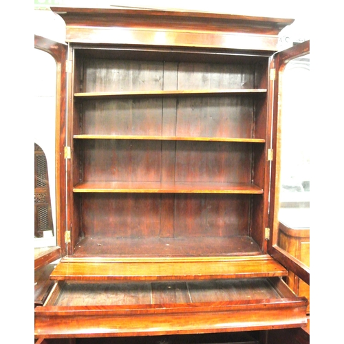 305 - Victorian mahogany bookcase with glazed doors, shelving, drawer, press under, on plinth