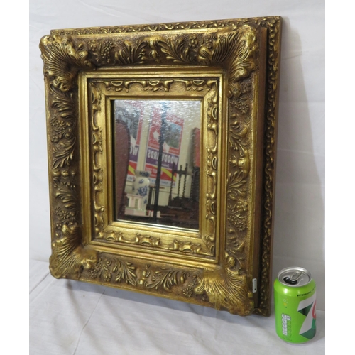 328 - Regency style gilt framed wall mirror with ornate floral and shell decoration