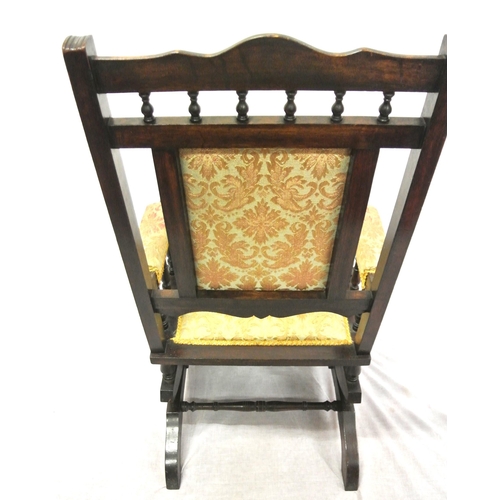 380 - Victorian style rocking armchair with turned rails, floral upholstery, on shaped base