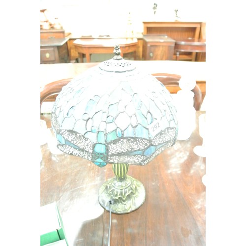 292 - Art deco style bronzed electric lamp with panelled coloured shade and butterfly decoration