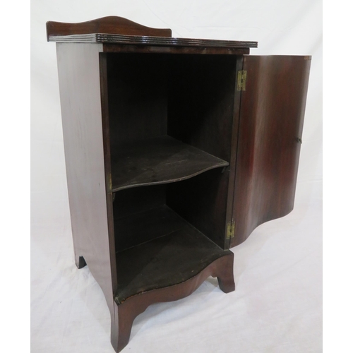 69 - Edwardian style crossbanded serpentine fronted press with shaped shelving, on bracket feet