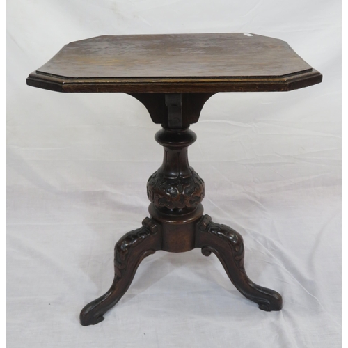 74 - Oak and mahogany occasional table with shaped column, on foliate carved tripod