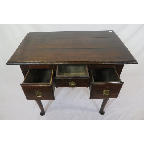 135 - Georgian oak lowboy with 3 drawers, brass drop handles with round backplates, on cabriole legs with ... 