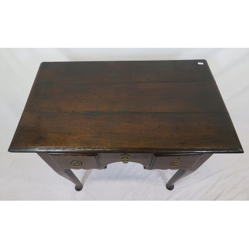 135 - Georgian oak lowboy with 3 drawers, brass drop handles with round backplates, on cabriole legs with ... 