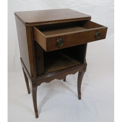 101 - Edwardian mahogany cabinet with frieze drawer, drop handles, press with tambour front, on shaped inl... 