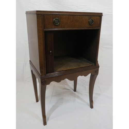 101 - Edwardian mahogany cabinet with frieze drawer, drop handles, press with tambour front, on shaped inl... 