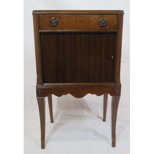 101 - Edwardian mahogany cabinet with frieze drawer, drop handles, press with tambour front, on shaped inl... 