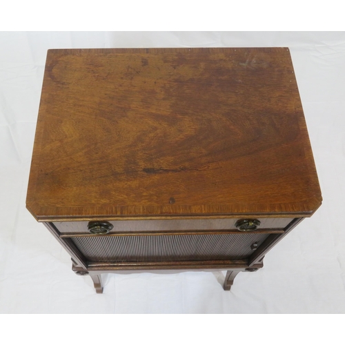 101 - Edwardian mahogany cabinet with frieze drawer, drop handles, press with tambour front, on shaped inl... 