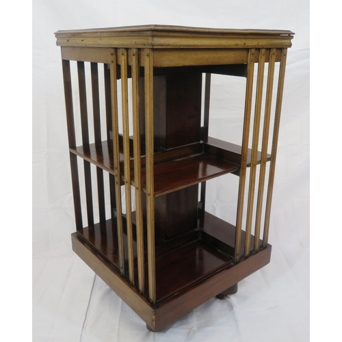 109 - Edwardian mahogany revolving bookcase with railed sides, on castors