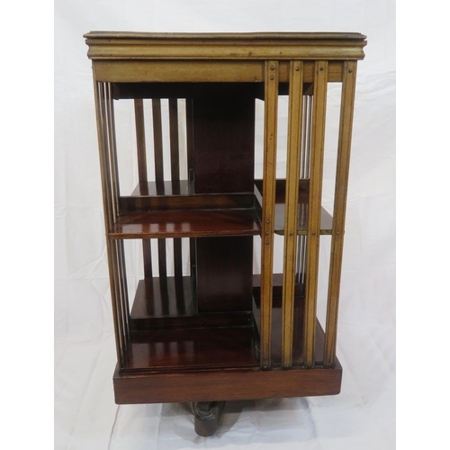 109 - Edwardian mahogany revolving bookcase with railed sides, on castors