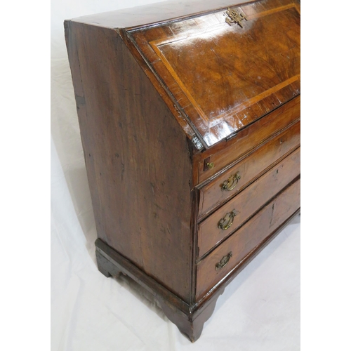 115 - Georgian walnut & mahogany crossbanded bureau with ornate brass escutcheon & brass drop handles, dro... 