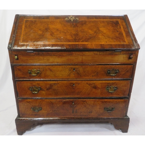 115 - Georgian walnut & mahogany crossbanded bureau with ornate brass escutcheon & brass drop handles, dro... 